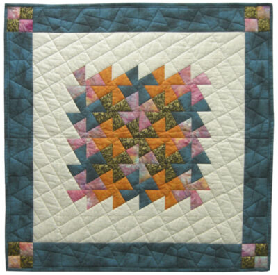 Image of contemporary textile artwork Fiesta Pinwheels (River Eddy #1) by Wisconsin artist Jean M. Judd.