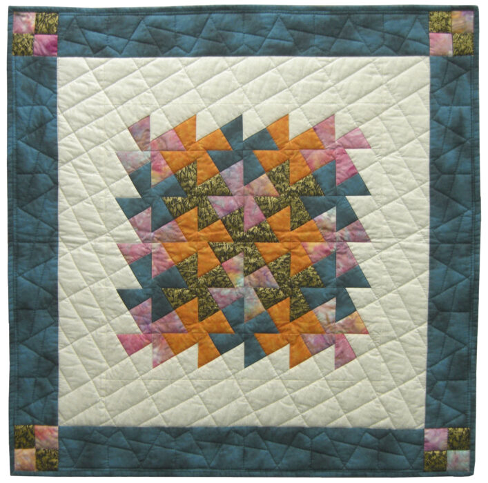 Image of contemporary textile artwork Fiesta Pinwheels (River Eddy #1) by Wisconsin artist Jean M. Judd.