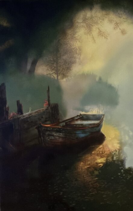 Boat moored to weathered dock in evening light